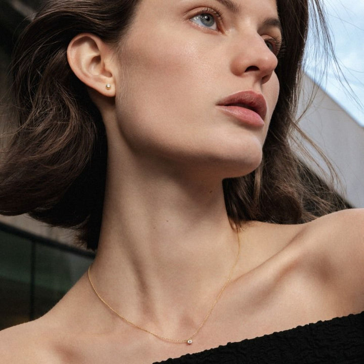 Signature Ohrstecker aus 18K Gold mit 0.10 ct. Diamant