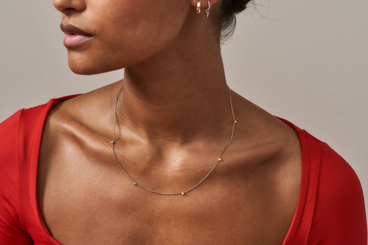 https://ik.imagekit.io/fzkghjurk1l/resize-external/https://storage.googleapis.com/shop_images/Akind/AKIND_StationDiamondNecklace_1.jpg?tr=w-2000,h-2000,c-at_max,f-jpg,bg-white