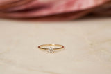 https://ik.imagekit.io/fzkghjurk1l/resize-external/https://storage.googleapis.com/shop_images/Akind/AKIND_SixProngDiamondRing0.3ct_Enviro.jpg?tr=w-2000,h-2000,c-at_max,f-jpg,bg-white