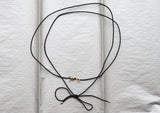 https://ik.imagekit.io/fzkghjurk1l/resize-external/https://storage.googleapis.com/shop_images/Akind/AKIND_GoldSpiralCordNecklace_Enviro.jpg?tr=w-2000,h-2000,c-at_max,f-jpg,bg-white
