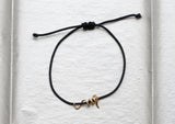 https://ik.imagekit.io/fzkghjurk1l/resize-external/https://storage.googleapis.com/shop_images/Akind/AKIND_GoldSpiralCordBracelet_Enviro.jpg?tr=w-2000,h-2000,c-at_max,f-jpg,bg-white