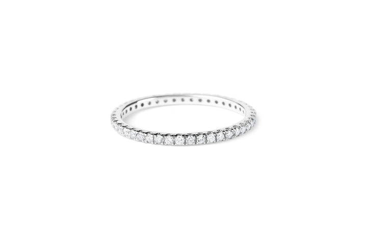 https://ik.imagekit.io/fzkghjurk1l/resize-external/https://storage.googleapis.com/shop_images/Akind/AKIND_AllianceDiamondRing_Laying_WG_Studio.png?tr=w-2000,h-2000,c-at_max,f-jpg,bg-white