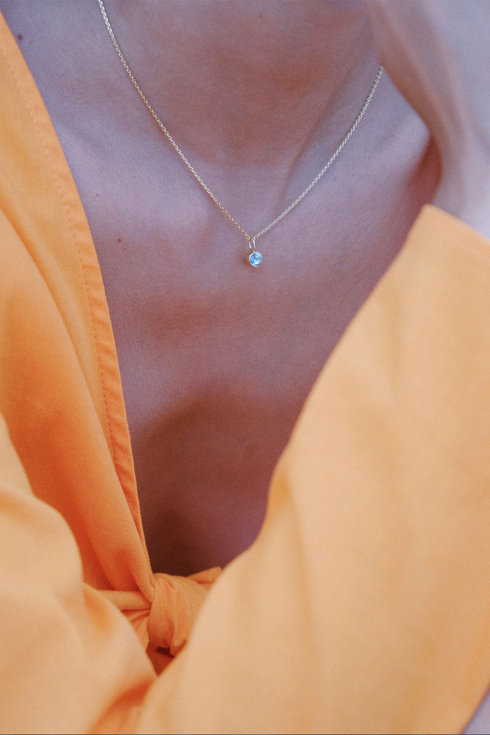 The Smiley 18K Gold Pendant w. light blue Topaz