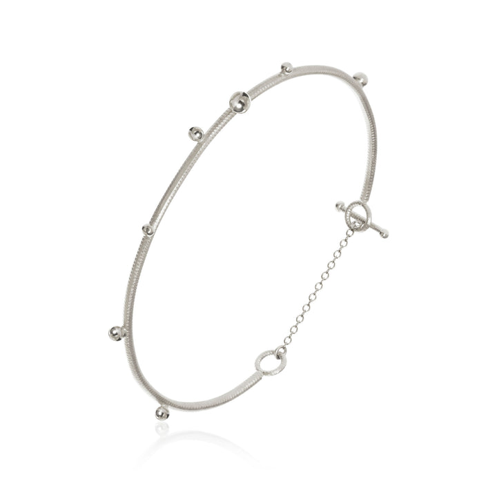 Delphis Silver Bangle
