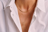 https://ik.imagekit.io/fzkghjurk1l/resize-external/https://storage.googleapis.com/shop_images/Akind/AKIND_FigaroChainNecklace_2.jpg?tr=w-2000,h-2000,c-at_max,f-jpg,bg-white
