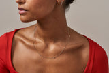 https://ik.imagekit.io/fzkghjurk1l/resize-external/https://storage.googleapis.com/shop_images/Akind/AKIND_StationDiamondNecklace_1.jpg?tr=w-2000,h-2000,c-at_max,f-jpg,bg-white