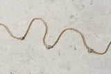 https://ik.imagekit.io/fzkghjurk1l/resize-external/https://storage.googleapis.com/shop_images/Akind/AKIND_StationDiamondNecklace_YG_Enviro.jpg?tr=w-2000,h-2000,c-at_max,f-jpg,bg-white