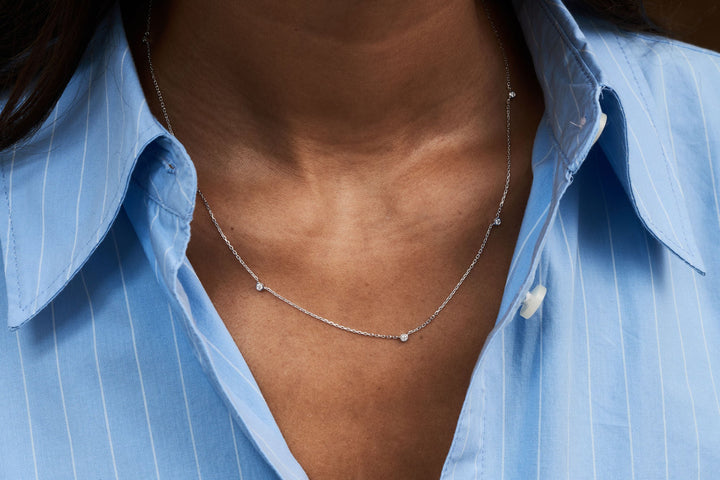 https://ik.imagekit.io/fzkghjurk1l/resize-external/https://storage.googleapis.com/shop_images/Akind/AKIND_StationDiamondNecklace_3.jpg?tr=w-2000,h-2000,c-at_max,f-jpg,bg-white