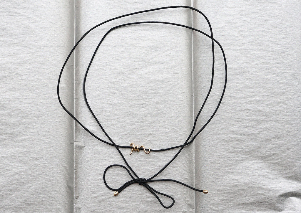 https://ik.imagekit.io/fzkghjurk1l/resize-external/https://storage.googleapis.com/shop_images/Akind/AKIND_GoldSpiralCordNecklace_Enviro.jpg?tr=w-2000,h-2000,c-at_max,f-jpg,bg-white