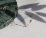 https://ik.imagekit.io/fzkghjurk1l/resize-external/https://storage.googleapis.com/shop_images/Akind/AKIND_DiamondBracelet_YG_Enviro.png?tr=w-2000,h-2000,c-at_max,f-jpg,bg-white