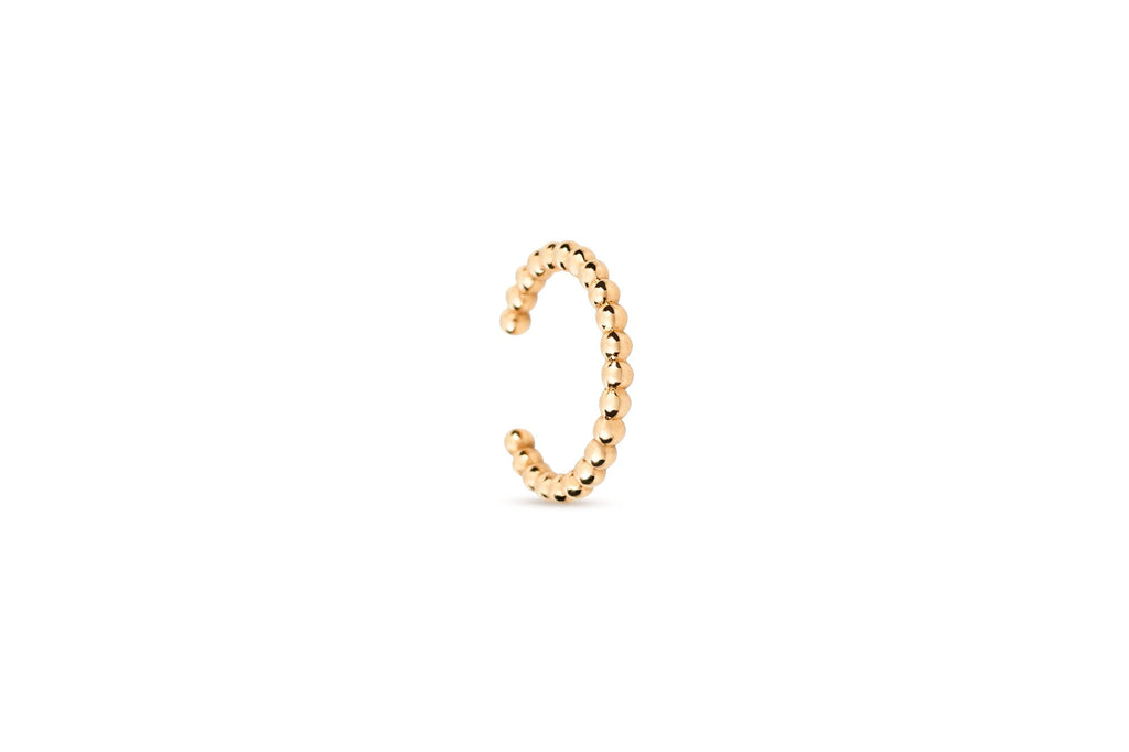 https://ik.imagekit.io/fzkghjurk1l/resize-external/https://storage.googleapis.com/shop_images/Akind/AKIND_BeadedEarCuff_YG_Studio.png?tr=w-2000,h-2000,c-at_max,f-jpg,bg-white