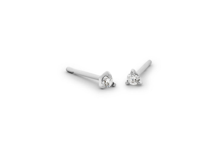 https://ik.imagekit.io/fzkghjurk1l/resize-external/https://storage.googleapis.com/shop_images/Akind/AKIND_ThreeProngDiamondStuds_WG_Studio.png?tr=w-2000,h-2000,c-at_max,f-jpg,bg-white