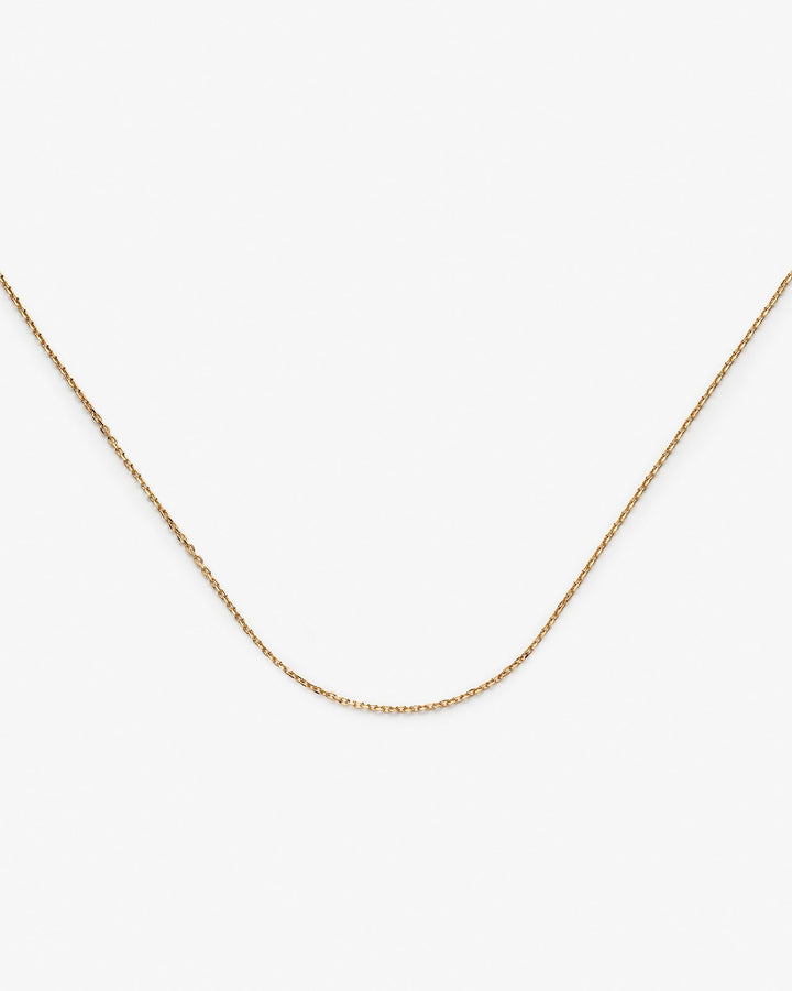 https://ik.imagekit.io/fzkghjurk1l/resize-external/https://storage.googleapis.com/shop_images/Akind/Petite%20Chain%20Necklace%20YG%20%283%29.jpg?tr=w-2000,h-2000,c-at_max,f-jpg,bg-white