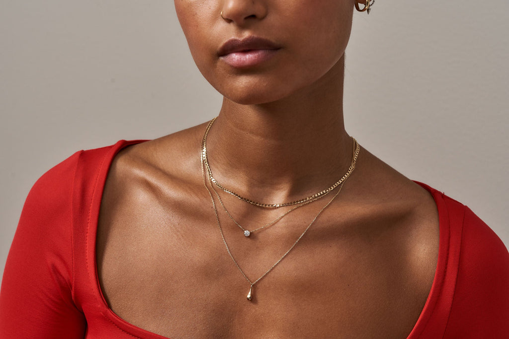 https://ik.imagekit.io/fzkghjurk1l/resize-external/https://storage.googleapis.com/shop_images/Akind/AKIND_DiamondNecklace_0.25ct_1.jpg?tr=w-2000,h-2000,c-at_max,f-jpg,bg-white