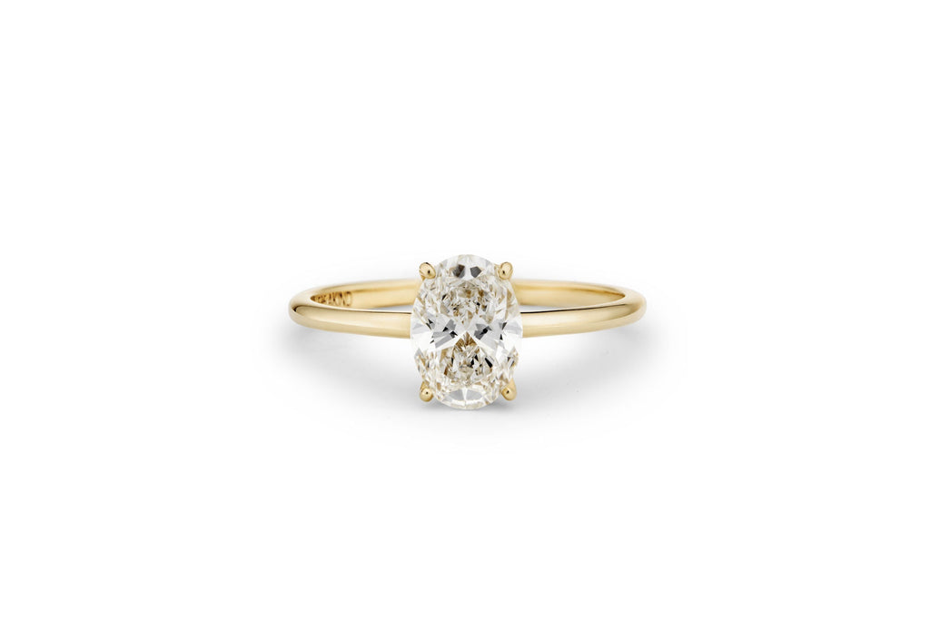 https://ik.imagekit.io/fzkghjurk1l/resize-external/https://storage.googleapis.com/shop_images/Akind/AKIND_OvalCutDiamondRing1.0ct_Laying_YG_Studio.png?tr=w-2000,h-2000,c-at_max,f-jpg,bg-white