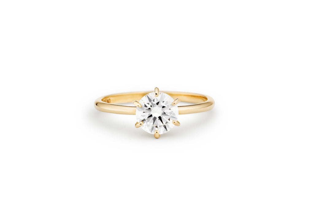 https://ik.imagekit.io/fzkghjurk1l/resize-external/https://storage.googleapis.com/shop_images/Akind/AKIND_SixProngDiamondRing1.0ct_Lyaing_YG_Studio.png?tr=w-2000,h-2000,c-at_max,f-jpg,bg-white