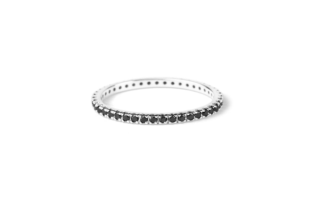 https://ik.imagekit.io/fzkghjurk1l/resize-external/https://storage.googleapis.com/shop_images/Akind/AKIND_AllianceBlackDiamondRIng_Laying_WG_Studio.png?tr=w-2000,h-2000,c-at_max,f-jpg,bg-white