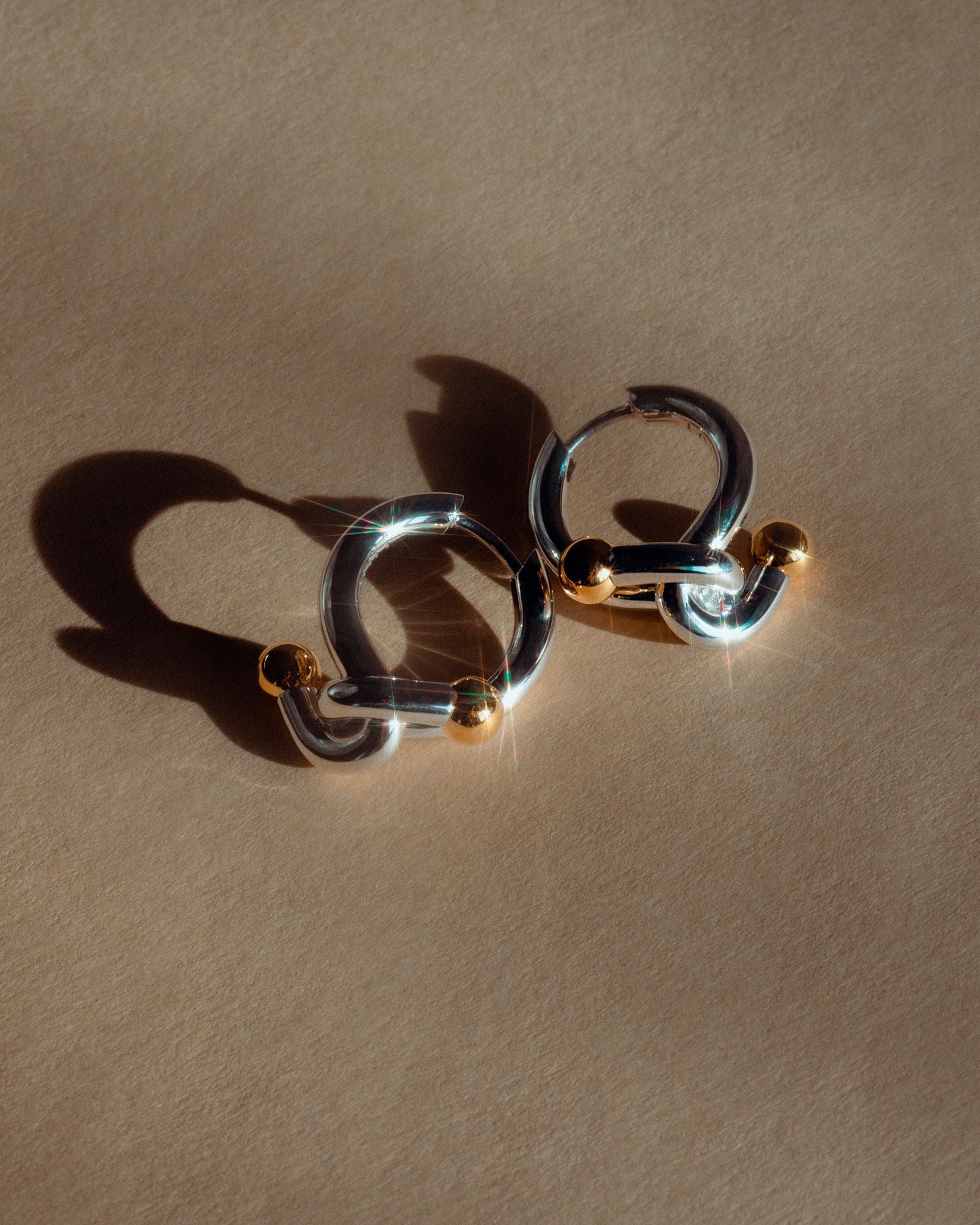 Falcate Rhodium Plated Silver Earrings