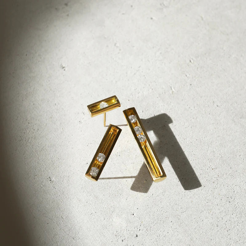 Moving S 18K Gold Ohrring w. Diamant