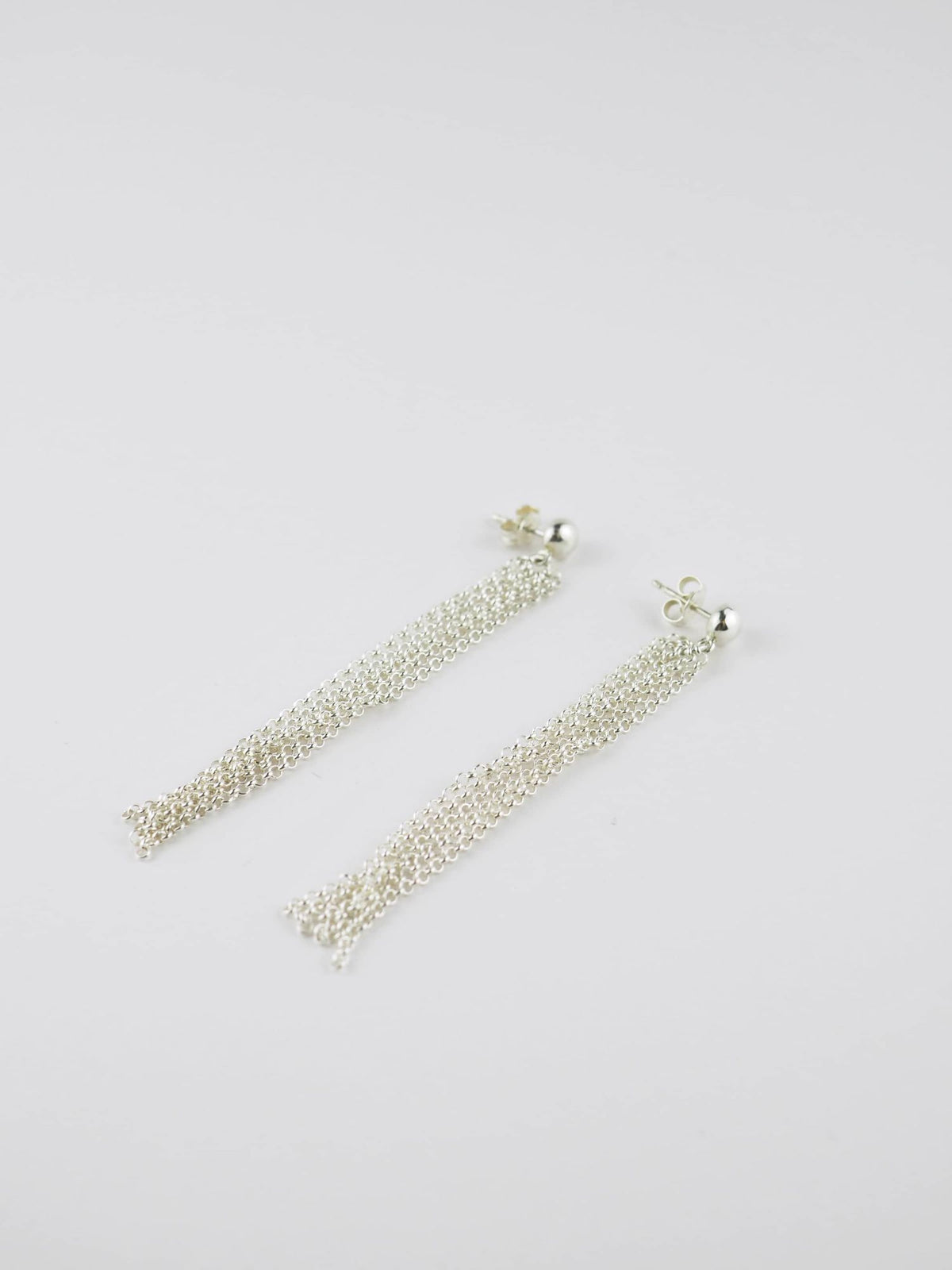 Long Pompons Silver Earrings